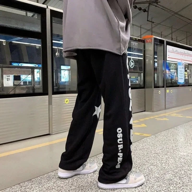 Nouveaux hommes pantalons de survêtement légers couleur unie Joggers impression hommes Baggy pantalon Streetwear pantalons longs hommes tendance polyvalent